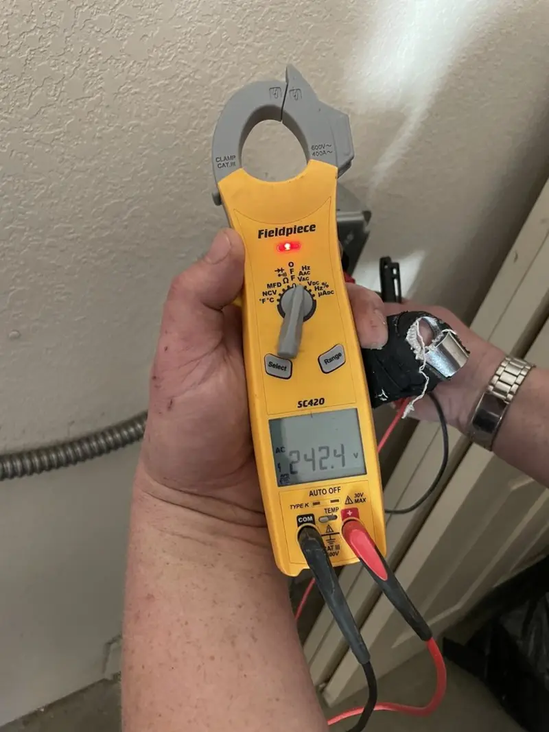 Voltage testing with clamp meter during Electrical Installation Services in Fox Island